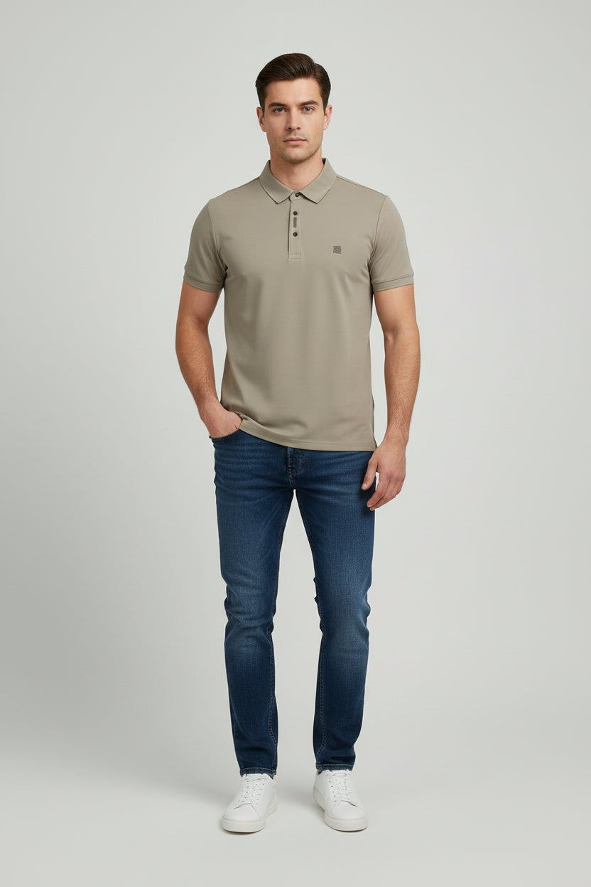 Beige polo shirt on a white surface